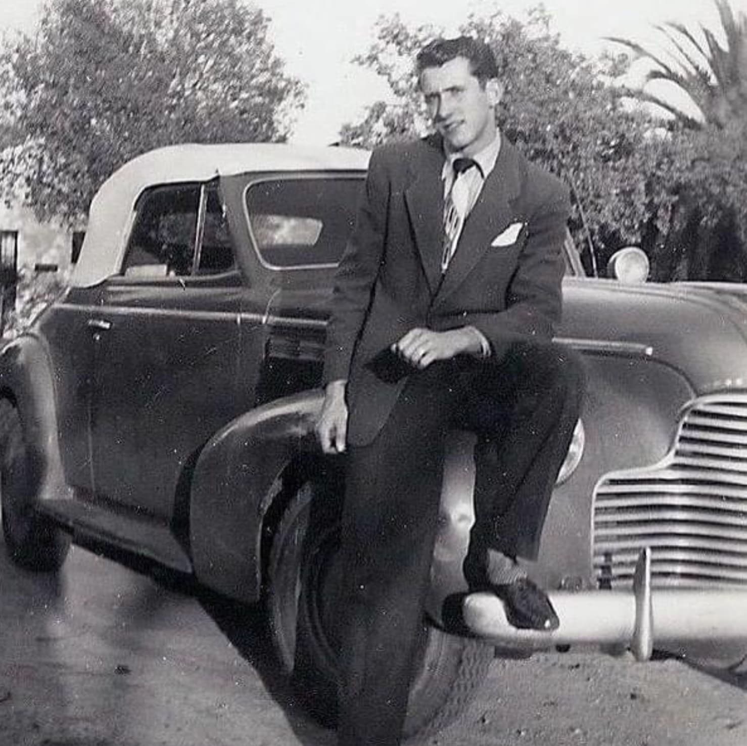 “My grandpa at age 16 next to his uncle’s car [Late 1940s].”